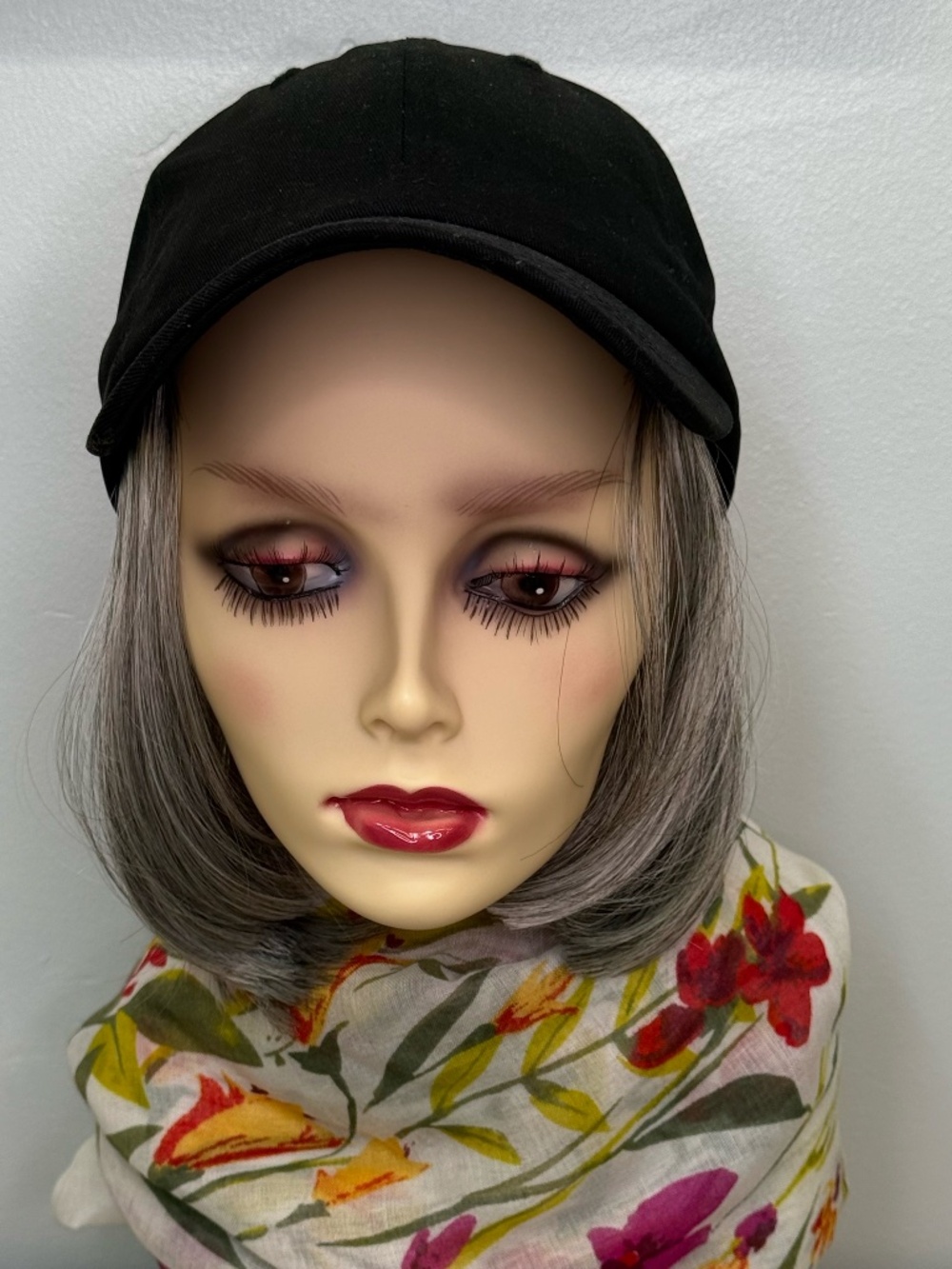 Baseball cap with gray hair